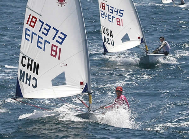 Laser Radial World Champion Lijia Xu (CHN) charging downwind.