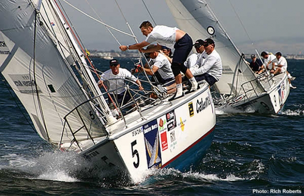 Hard-driving Gavin Brady (at wheel) leads fellow semifinalist Ed Baird into the windward mark Friday.
