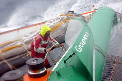 Groupama 3 - Cammas gets a dunking. Photo &copy;; Groupama
