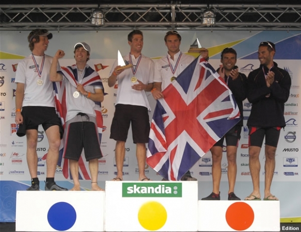 Two Brit teams on the 470 Men podium - from left to right: Stuart Bithell, Luke Patience, Nic Asher, Elliot Willis, Spain's Onan Barreiros and Aaron Sarmiento