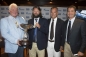Valery Golubev, Deputy Chairman of the Gazprom Management Committee, Vladimir Liubomirov, Commodore of Saint Petersburg YC holding the Gazprom Swan 60 Trophy, Leonardo Ferragamo, Chairman of Nautor’s Swan and Enrico Chieffi, MD of Nautor's Swan